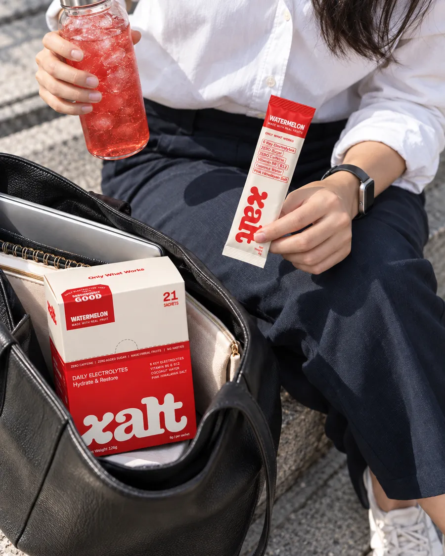 A drink, a Watermelon sachet and a box of XALT in a work bag